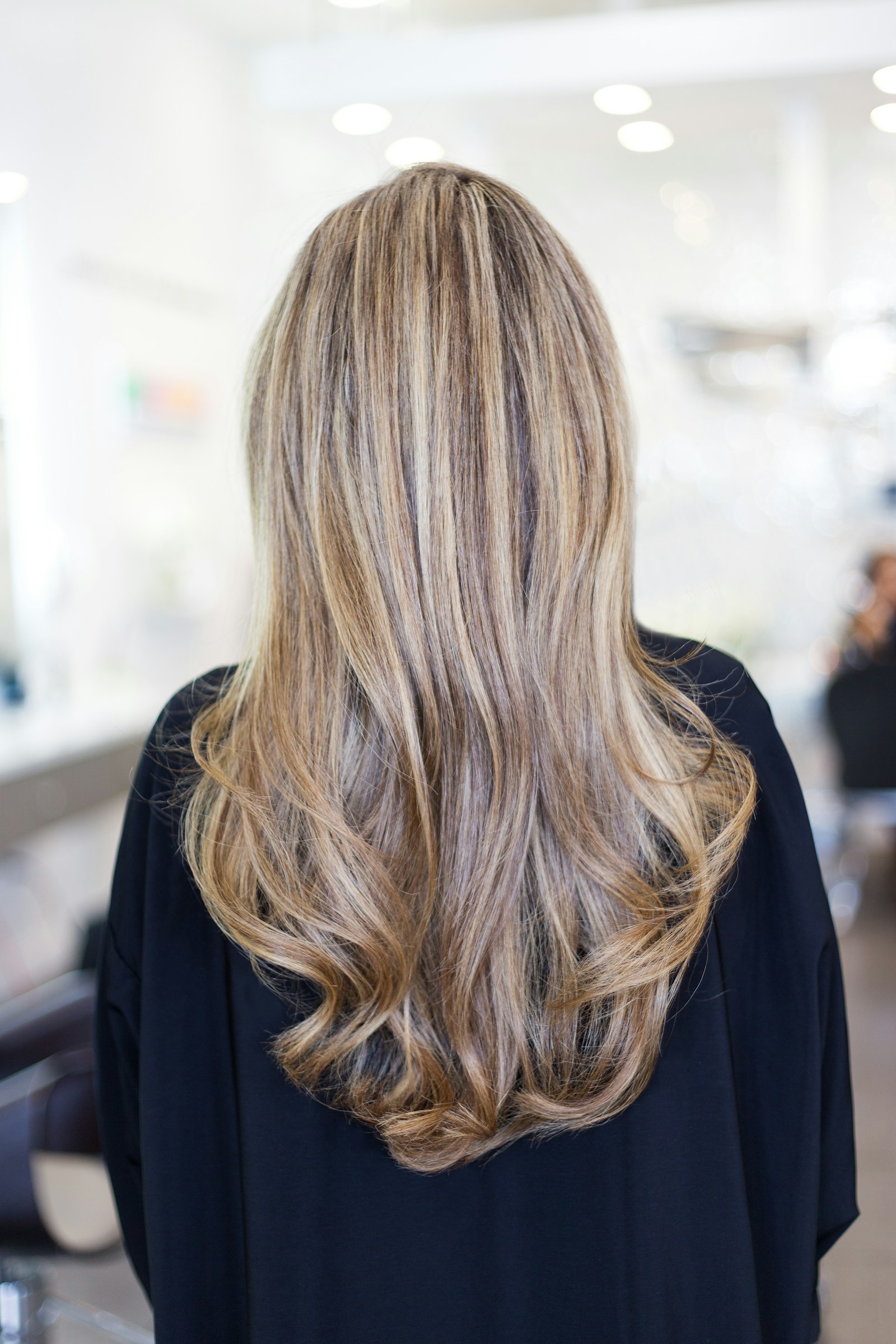 Long styled hair shown from behind